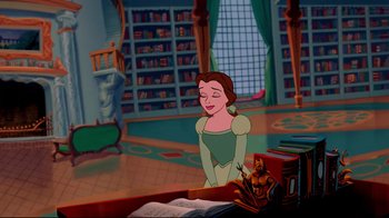 Movie still from “Beauty and the Beast” (1991), directed by Kirk Wise – A woman in a green dress standing in front of books; Wide shot, High angle