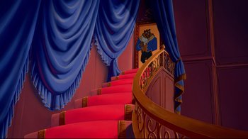 Movie still from “Beauty and the Beast” (1991), directed by Kirk Wise – A painting of a bear on the wall of a staircase; Wide shot, Low angle
