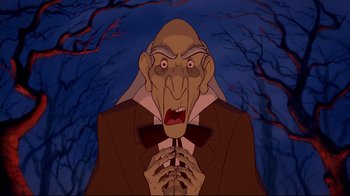 Movie still from “Beauty and the Beast” (1991), directed by Kirk Wise – An old man in a suit and bow tie is holding his hands to his mouth; Medium shot, Low angle
