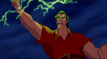 Movie still from “Beauty and the Beast” (1991), directed by Kirk Wise – A man in a red shirt and a green hat; Medium shot, Low angle