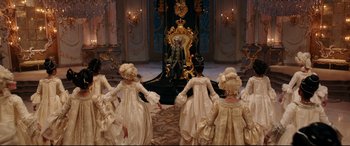 Movie still from “Beauty and the Beast” (2017), directed by Bill Condon – A group of people dressed in period costumes; Wide shot, High angle
