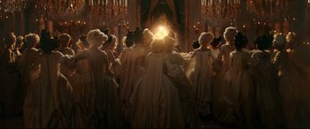 Movie still from “Beauty and the Beast” (2017), directed by Bill Condon – A group of people dressed in period clothing; Wide shot, Low angle