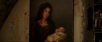 Movie still from “Beauty and the Beast” (2017), directed by Bill Condon – A painting of a woman holding a baby in her arms; Close Up shot, High angle