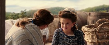 Movie still from “Beauty and the Beast” (2017), directed by Bill Condon – A young girl in a blue dress and a woman in a white dress; Close Up shot, Over the shoulder angle