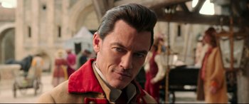 Movie still from “Beauty and the Beast” (2017), directed by Bill Condon – A person wearing a red jacket; Close Up shot, Over the shoulder angle