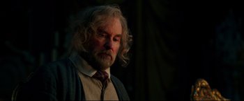Movie still from “Beauty and the Beast” (2017), directed by Bill Condon – An old man with a beard and a tie; Close Up shot, Low angle