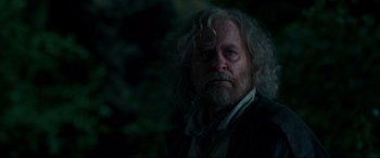 Movie still from “Beauty and the Beast” (2017), directed by Bill Condon – An old man with a long white beard and mustache; Close Up shot, Over the shoulder angle