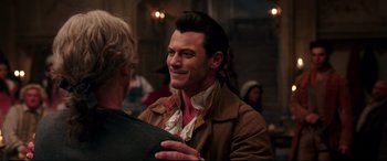 Movie still from “Beauty and the Beast” (2017), directed by Bill Condon – A person wearing a jacket; Close Up shot, Over the shoulder angle