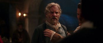 Movie still from “Beauty and the Beast” (2017), directed by Bill Condon – An old man with a beard and a long white beard; Close Up shot, Over the shoulder angle