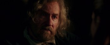 Movie still from “Beauty and the Beast” (2017), directed by Bill Condon – An old man with a beard and a tie; Close Up shot, Over the shoulder angle