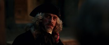 Movie still from “Beauty and the Beast” (2017), directed by Bill Condon – A person wearing a hat; Close Up shot, Over the shoulder angle