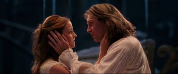 Movie still from “Beauty and the Beast” (2017), directed by Bill Condon – A man and a woman are looking into each others eyes; Close Up shot, Low angle