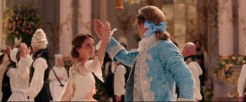 Movie still from “Beauty and the Beast” (2017), directed by Bill Condon – A man and a woman dressed up in costumes; Medium shot, Low angle