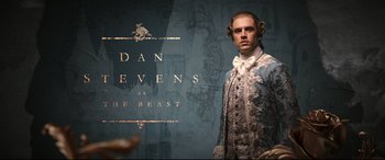 Movie still from “Beauty and the Beast” (2017), directed by Bill Condon – A man dressed in period clothing standing in front of a wall; Medium shot, Low angle