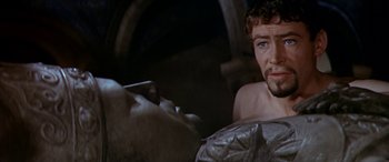 Movie still from “Becket” (1964), directed by Peter Glenville – A man and a woman are looking at each other in a dark room; Close Up shot, Over the shoulder angle