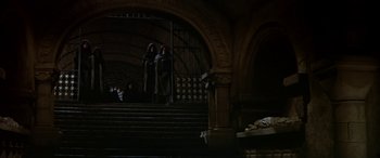 Movie still from “Becket” (1964), directed by Peter Glenville – Two people are standing on the steps of a building; Extreme Wide shot, High angle