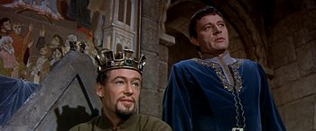 Movie still from “Becket” (1964), directed by Peter Glenville – Two men in medieval garb are sitting next to each other; Medium shot, Low angle