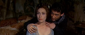 Movie still from “Becket” (1964), directed by Peter Glenville – A man and a woman are standing next to each other; Close Up shot, Over the shoulder angle