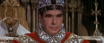 Movie still from “Becket” (1964), directed by Peter Glenville – A person wearing a crown; Close Up shot, High angle