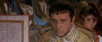 Movie still from “Becket” (1964), directed by Peter Glenville – A person wearing a suit of armor; Close Up shot, Over the shoulder angle