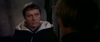 Movie still from “Becket” (1964), directed by Peter Glenville – A man looking at himself in the mirror in front of a mirror; Close Up shot, Over the shoulder angle
