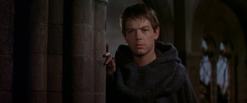 Movie still from “Becket” (1964), directed by Peter Glenville – A young man holding a cigarette in his hand; Close Up shot, Low angle