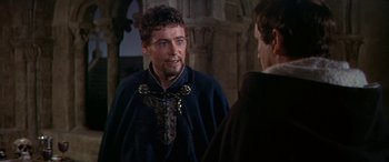 Movie still from “Becket” (1964), directed by Peter Glenville – A person wearing a suit and tie; Medium shot, Over the shoulder angle