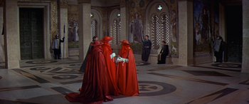 Movie still from “Becket” (1964), directed by Peter Glenville – A group of people dressed up in red robes; Extreme Wide shot, High angle