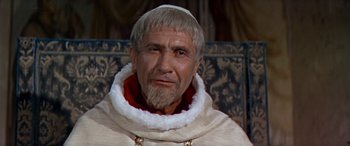Movie still from “Becket” (1964), directed by Peter Glenville – An old man with a beard and a white beard; Close Up shot, Over the shoulder angle