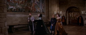 Movie still from “Becket” (1964), directed by Peter Glenville – A group of people dressed in medieval costumes; Wide shot, High angle