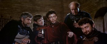 Movie still from “Becket” (1964), directed by Peter Glenville – A group of men standing next to each other holding cups; Medium shot, High angle