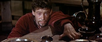 Movie still from “Becket” (1964), directed by Peter Glenville – A person sitting at a table; Close Up shot, High angle