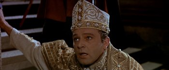 Movie still from “Becket” (1964), directed by Peter Glenville – A person wearing a crown; Close Up shot, High angle