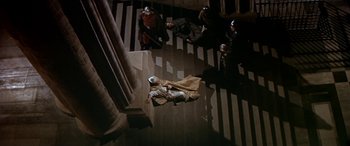 Movie still from “Becket” (1964), directed by Peter Glenville – A group of people standing on top of a staircase; Wide shot, Overhead angle