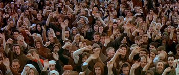 Movie still from “Becket” (1964), directed by Peter Glenville – A large group of people in a stadium; Wide shot, High angle
