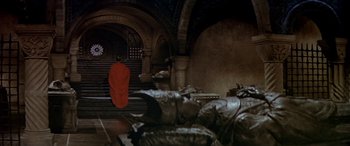 Movie still from “Becket” (1964), directed by Peter Glenville – A man in a red robe standing in front of a staircase; Extreme Wide shot, High angle