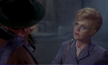 Movie still from “Bedknobs and Broomsticks” (1971), directed by Ward Kimball – A man and a woman talking to each other; Close Up shot, Over the shoulder angle
