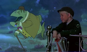Movie still from “Bedknobs and Broomsticks” (1971), directed by Ward Kimball – A boy sitting in front of an animated picture of a fish; Medium shot, High angle