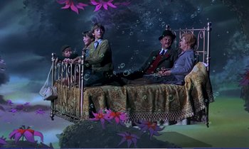 Movie still from “Bedknobs and Broomsticks” (1971), directed by Ward Kimball – A group of people sitting on a bed in a room; Wide shot, High angle