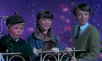 Movie still from “Bedknobs and Broomsticks” (1971), directed by Ward Kimball – A group of people standing next to each other on a stage; Medium shot, High angle