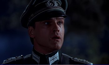 Movie still from “Bedknobs and Broomsticks” (1971), directed by Ward Kimball – A person wearing a uniform; Close Up shot, Low angle