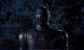 Movie still from “Bedknobs and Broomsticks” (1971), directed by Ward Kimball – The back end of a statue of a man in armor; Medium shot, Low angle