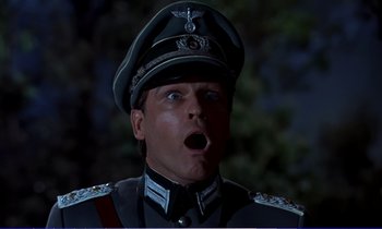 Movie still from “Bedknobs and Broomsticks” (1971), directed by Ward Kimball – A man in a military uniform with a surprised look on his face; Close Up shot, Low angle