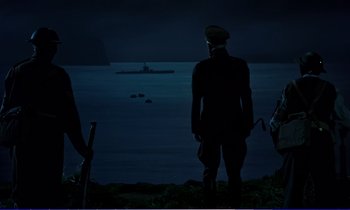 Movie still from “Bedknobs and Broomsticks” (1971), directed by Ward Kimball – A man standing on the beach at night; Extreme Wide shot, Low angle