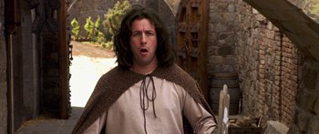 Movie still from “Bedtime Stories” (2008), directed by Adam Shankman – A man with long brown hair wearing a brown cape; Medium shot, Over the shoulder angle