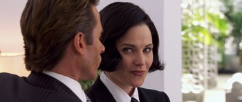 Movie still from “Bedtime Stories” (2008), directed by Adam Shankman – A man and a woman wearing suits and ties; Close Up shot, Over the shoulder angle