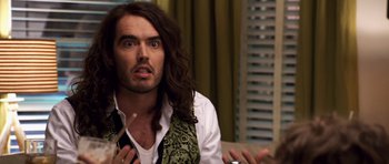 Movie still from “Bedtime Stories” (2008), directed by Adam Shankman – A man with long black hair is sitting in front of another man; Close Up shot, Over the shoulder angle