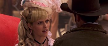 Movie still from “Bedtime Stories” (2008), directed by Adam Shankman – A woman wearing a pink hat and a man wearing a cowboy hat; Close Up shot, Over the shoulder angle