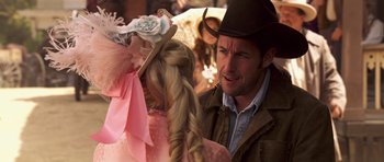 Movie still from “Bedtime Stories” (2008), directed by Adam Shankman – A man and a woman wearing cowboy hats; Close Up shot, Over the shoulder angle