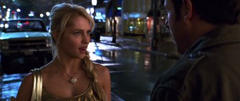 Movie still from “Bedtime Stories” (2008), directed by Adam Shankman – A beautiful young lady standing next to a man on the street; Close Up shot, Over the shoulder angle